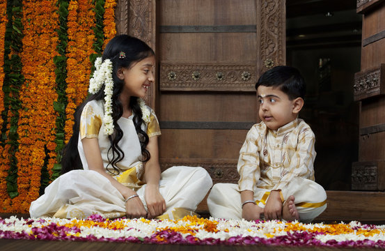 South Indian girl sitting with her brother 