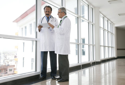Two doctors with a digital tablet