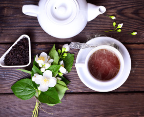 Hot black tea in a white cup and saucer