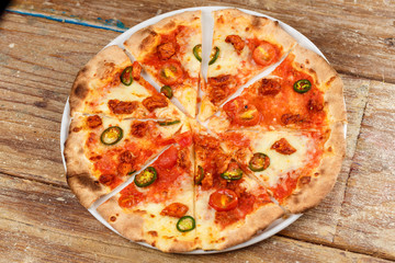 Artichoke pizza on a metal shovel