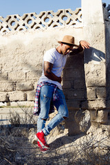 Young man with tattoo outdoor full size