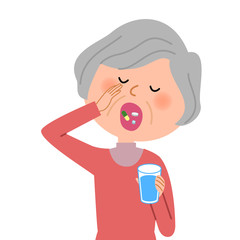 薬を飲むシニア女性