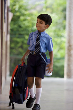 School boy with a school bag 