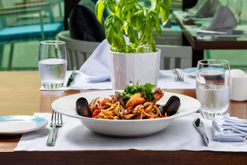 spaghetti sea food on white plate.