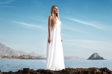 spectacular view of the beach and lady in white dress