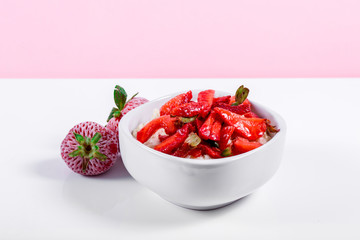 Cereal in White bowl with strawberries