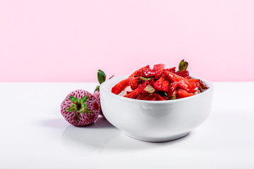 Cereal in White bowl with strawberries
