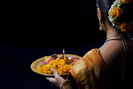 Rear view of woman celebrating Diwali festival