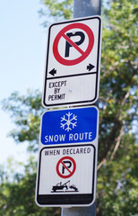 Snow route no parking sign