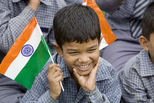 School boy holding the Indian Flag 