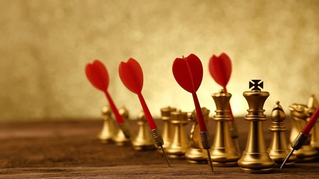 business strategy ideas concept with golden chess with red dart arrow