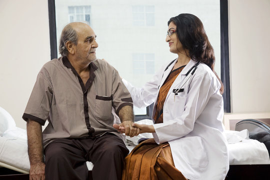 Doctor sitting with her patient 