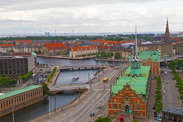 Fototapeta na wymiar Waterfront city buildings along the canal in Copenhagen, Denmark. Copenhagen city panorama in summer, Denmark.
