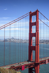 First tower of the Golden Gate Bridge and San Francisco downtown in the sunny day