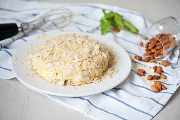 Homemade sweet cake with almonds and cream