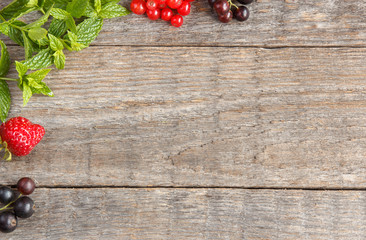 Summer berry mint on wooden background. Copy space