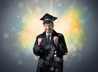 Happy graduate with colorful bokeg lights in the background