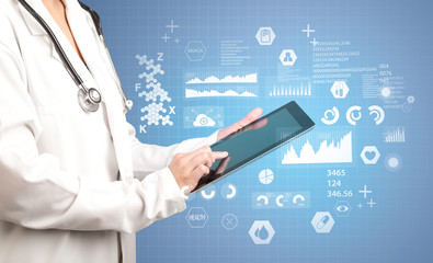 Female doctor with tablet