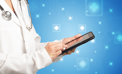 Female doctor with tablet