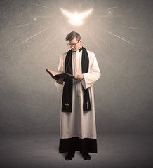 young priest in giving his blessing