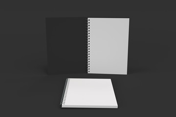 Two notebooks with spiral bound on black background