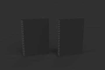 Obraz premium Two notebooks with spiral bound on black background