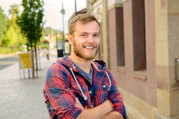 young bearded man in checkered shirt