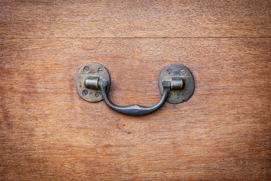 Brass Side Handle Of Vintage Wooden Chest. Antique Furniture Hardware Detail.