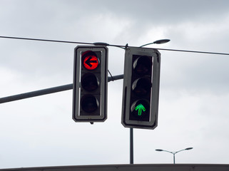 Two traffic lights allows to move forward and forbids turn to the left