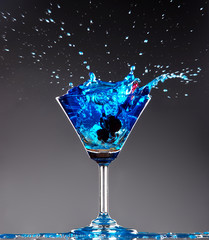 blue cocktail splashing