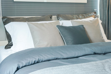 Close up pillows on bed in modern interior bedroom