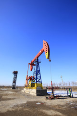 Fototapeta na wymiar Oil field, oil pump in the work