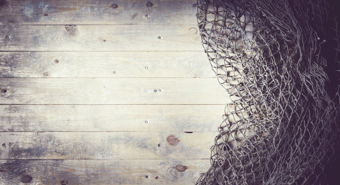 Fishing nets on wooden background. Still-life and objects.