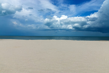 Sand and cloud sky on the beach.