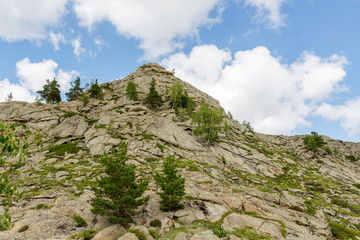 Beautiful mountain landscape, rocks and blue sky with clouds