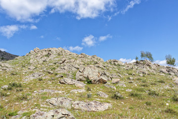 Beautiful mountain landscape, rocks and blue sky with clouds
