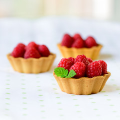 Mini tart with raspberries fruits