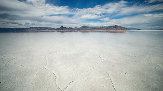 Time lapse over Bonneville Salt Flats with clear water blowing in the wind