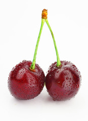 Cherry on a white background with drops of water