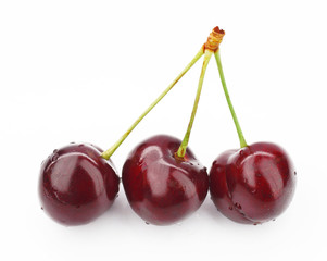 Cherry on a white background with drops of water