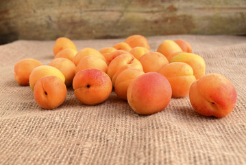 Apricots are on a table. Fruit are fresh, juicy, mature, .