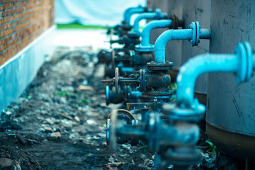 The valves at the connection pipe steel and pvc.Manual valve.Old brass valve.selective focus.