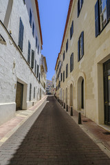 Fototapeta na wymiar Narrow Porto Mahon street