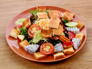 vegetable salad on wooden background