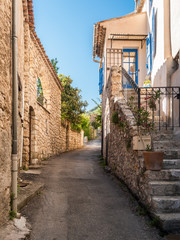 Glimpse of a street at Moustiers-Sainte-Marie, small town in Provence (France)