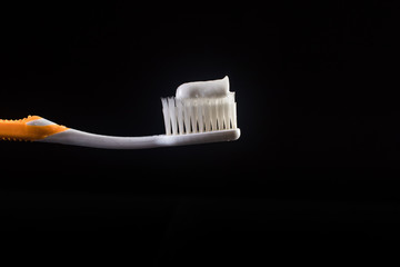 toothbrush black background