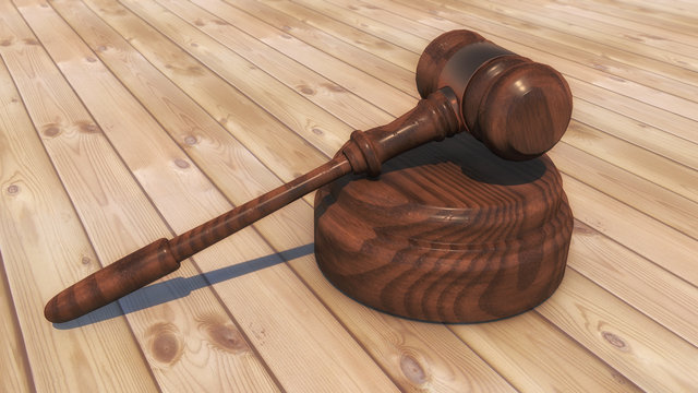 3d render. Judge's gavel and parquet flooring