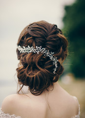 Beautiful bride with fashion wedding hairstyle outdoor - obrazy, fototapety, plakaty