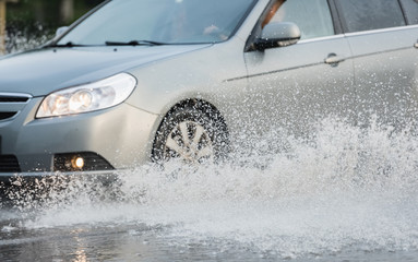 car rain puddle splashing water