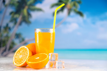 Fresh and cold orange juice served on beach